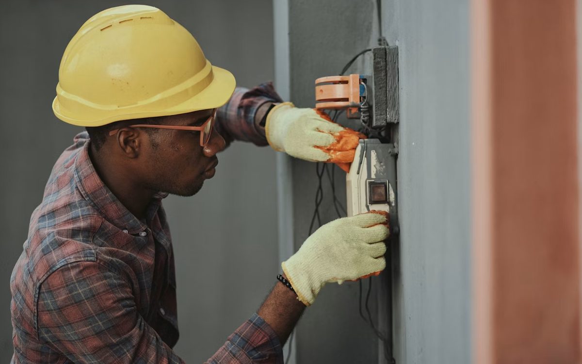 Engineer testing a portable electrical appliance